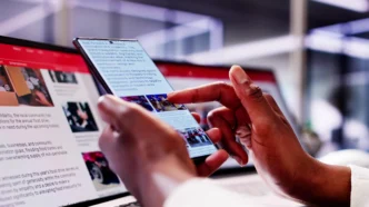 A person on a smartphone, with a focus on turning web links into notebooklm podcasts, showcasing productivity in action