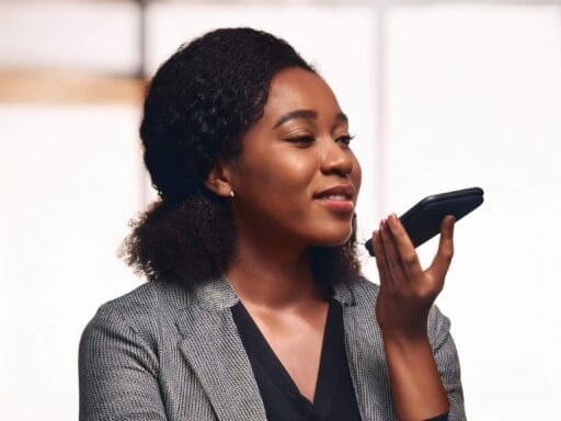 A woman recording voice notes on her phone, illustrating notebooklm's support for audio sources.